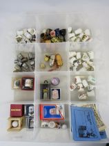 Large collection of various ceramic and metal collectable thimbles.