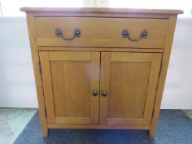 Light Oak Hall utility cupboard with drawer above. H:30 x W:29 x D:13 Inches. See photos. S2