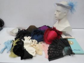 Selection of vintage ladies hats, gloves and stockings.
