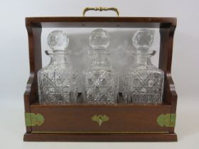 Vintage Oak and brass Tantalus and 3 matching crystal glass decanters, 13.5" tall and 15.5" long.