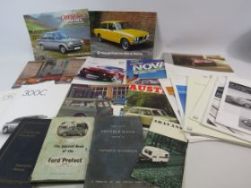 Various modern and vintage car brochures and books.