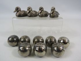 12 White metal table place setting holders Ducks and balls.