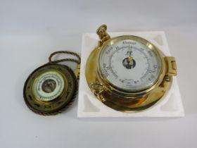 Unused boxed ships barometer plus a vintage enamel faced barometer.