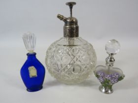 Vintage glass perfume atomoiser bottle plus two smaller bottles.