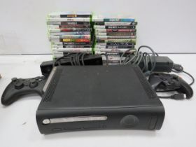 Xbox 360 console, 2 controllers, camera and a large selection of games.