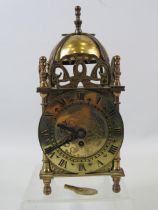 Small brass Smiths lantern mantle clock, approx 7" tall and in working condition.