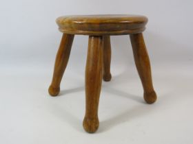 Small Antique wooden milking stool. 8" tall and 8" diameter.