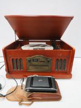 Turntable AM/FM radio and CD player which appears to be unused plus a vintage Kodak camera.