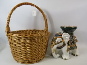 Stoneware elephant plant stand , 11" tall and a large basket with handle.