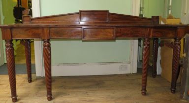 Flamed mahogany large reception table supported by 6 spiral tapered legs and button moulding to