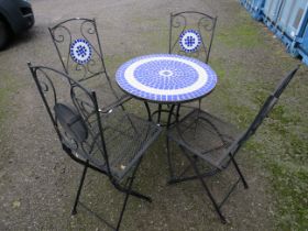 Metal Garden table with four maching chairs. Table has a mosaic centre to the top which is mirrored