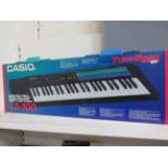 Boxed Casio CA100 keyboard.