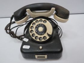 Vintage Bakelite dial round telephone.