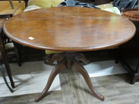 Circular Dining table raised on four bracket feet with central turned column. Has the benefit of a r