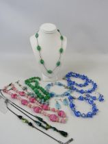 Selection of vintage and modern glass and semi precious stone costume jewellery.