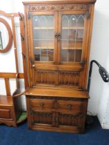 Old Charm Dresser with glazed cabinet and Glazed bookshelf above with leaded glass doors. Linen fold