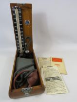 Vintage Accoson mercurial sphygmomanometer blood pressure monitor in original wooden box.