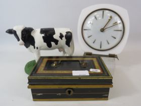 Mixed lot to include a retro Metamec clock, cast iron cow door stop and a vintage cash box.