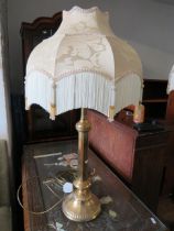 Brass table lamp with fancy frilled shade. Will need attention to work. 31 inches tall. See phot