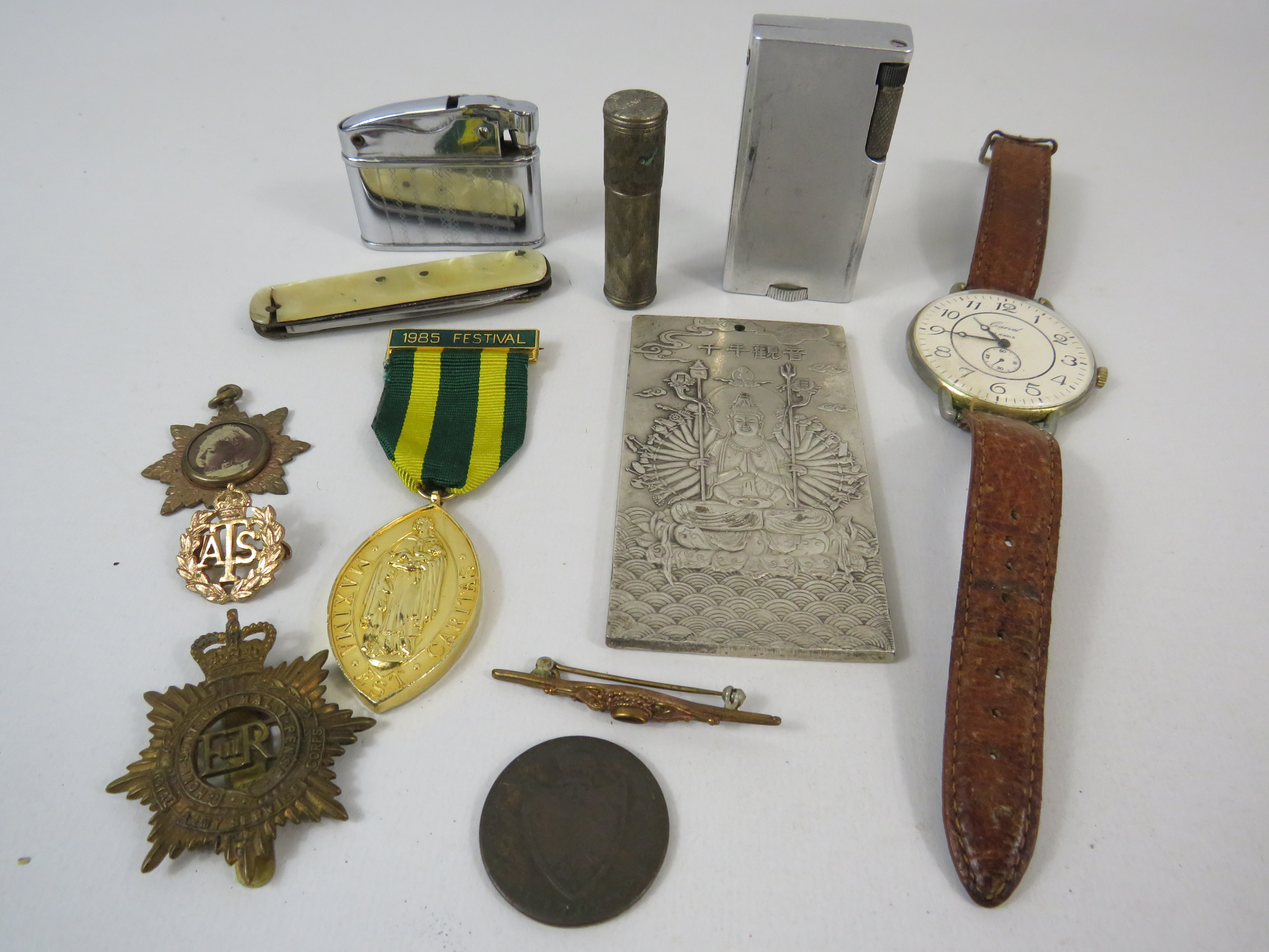 Interesting mixed lot to include military badges, lighters, pen knife etc.