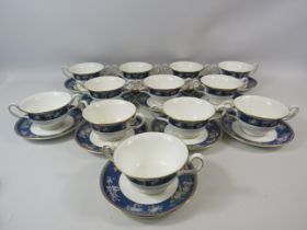 12 Wedgwood Blue Siam twin handle soup cups and saucers.