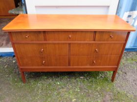 Vanson Seven drawer chest in good order. Made in mid to late 20th Century Teak with concave fronted
