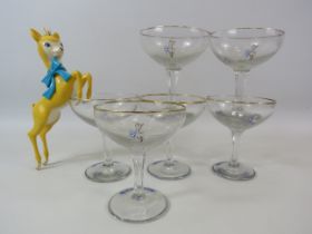 6 Babycham glasses with the white motif plus a leaping plastic figurine.