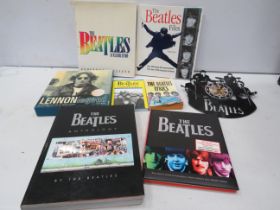 Selection of Beatles related books and a clock.