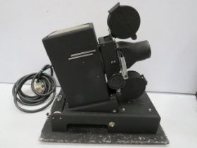 Vintage Eduscope slide projector in working order. Comes with original hard carry case. See photos.