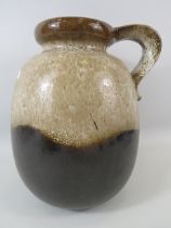 Large West German Fat Lava vase with a handle approx 12" tall.