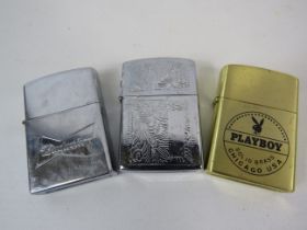 3 flip top lighters including Budwieser and Playboy.