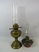 Brass duplex oil lamp and a copper chamber stick oil lamp.