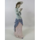 Large Lladro figurine of a lady reading, approx 14.5" tall comes with box.