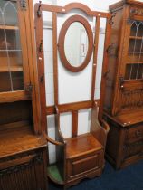 Early 20th Century Oak Hallstand of superior quality. Lifting Oak seat with twin stick & Brolly stan