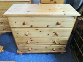 Nicely made knotty pine four drawer chest. Turned handles with matching bun feet it measures H:30 x