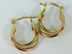 Pair of 9ct Yellow Gold Elongated 20mm twist hoops with milled patern. 1.8g
