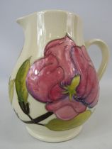 Moorcroft hibiscus pattern jug 5 3/4" tall.