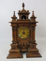 Carved wooden possibly german mantle clock , approx 14" tall. For spares or repair.