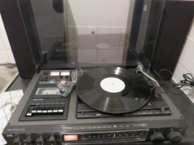 ITT Radio/casette/turntable with speakers. Lights come on when plugged in but working condition unk