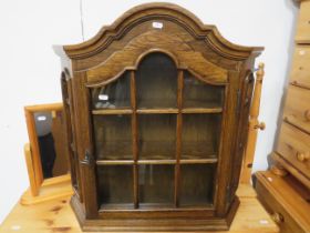 Dark wood glased cabinet. Can be free standing or wall mounted. Bow topped H:27 x D:16 x D:7 inches