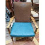 Stylish mid to late 20th Century Parker Knoll Armchair in sound condition but has non original leath