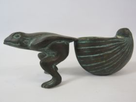 A Bronze frog pulling a sea shell approx 6.5" long and 2 3/4" tall