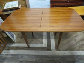 Good Quality fold over design Teak table with tapered legs. Measures H:29 x W:54 x D:33 inhces, exte