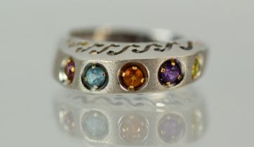14ct White gold multi coloured gemstone set ring with raised pierced mount. Finger size 'V' Total