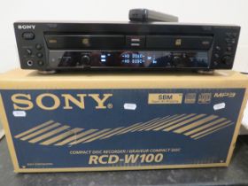 Sony Compact Disc Recorder RCD-W100. Lights come on when plugged in but working condition unknown.