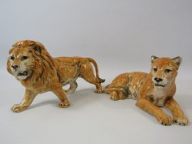 Carl Scheidig Porcelain Lion and Lioness figurines, The Lion measures 4 1/4" tall and 8" long.