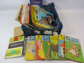 Selection of vintage childrens annuals and ladybird books etc.