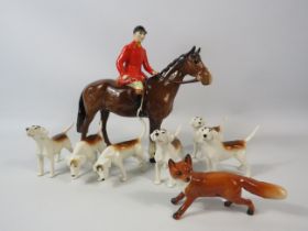 Beswick Huntsman plus 6 hounds and a fox.