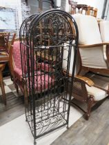 Wrought metal wine storage stand with locking front door. Excellent condition which measures H:54 x