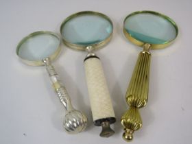 3 Vintage magnifying glasses.